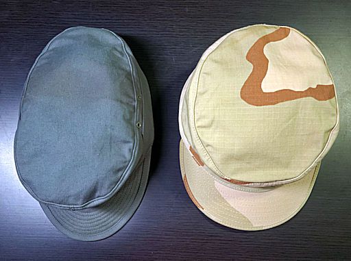 Photograph providing an example of the difference in crown shape between a German Bundeswehr field hat and a US military patrol cap.